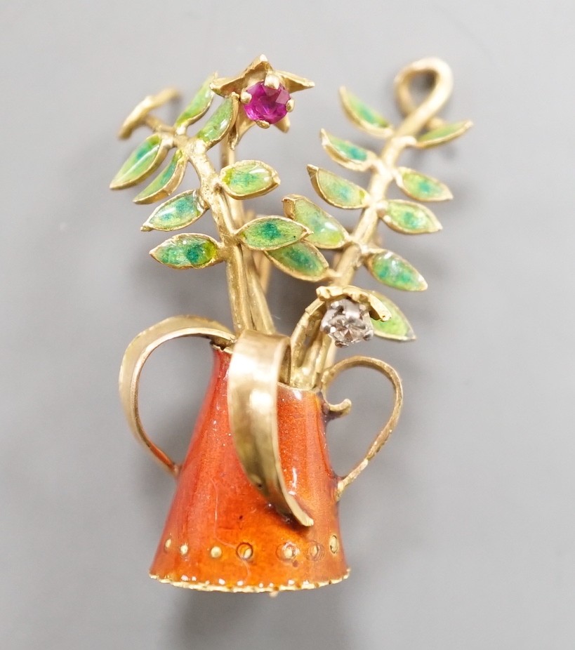 A French yellow metal (18ct poincon mark), two colour enamel, ruby and diamond set novelty brooch, modelled as a tyg with foliate stems, signed Marcel Pac, Paris, 29mm, gross weight 5.8 grams.